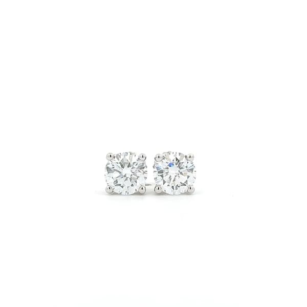 A pair of 2ct tdw round brilliant cut lab diamond studs set in a simple four-prong setting crafted from 14k white gold, displayed against a plain white background.