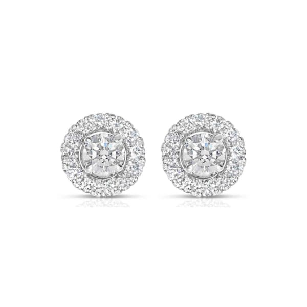 Product: A pair of sophisticated 0.72ct TDW round brilliant cut natural diamond studs, each showcasing a prominent central diamond encircled by a halo of smaller diamonds, elegantly set in a circular platinum frame. The earrings are presented against a simple white background.