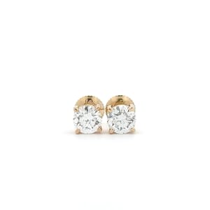 A pair of 1.40ct tdw round brilliant cut lab diamond studs in 14k yellow gold set against a plain white background.