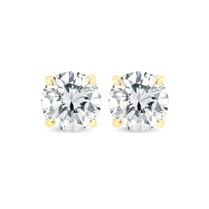 A pair of 1.40ct tdw round brilliant cut lab diamond stud earrings set in 14k yellow gold on a white background.