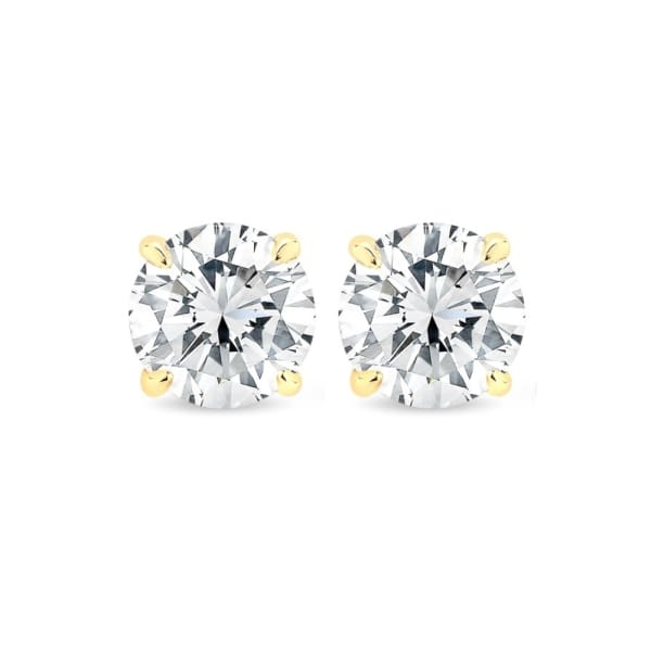 A pair of 1.40ct tdw round brilliant cut lab diamond stud earrings set in 14k yellow gold on a white background.