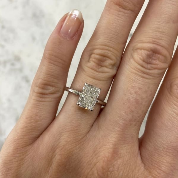 Stunning 2.04ct Radiant Lab Diamond Engagement Ring with 2 Pear Halo Lab Diamonds. A perfect fusion of modern brilliance and classic elegance, crafted to celebrate your love.