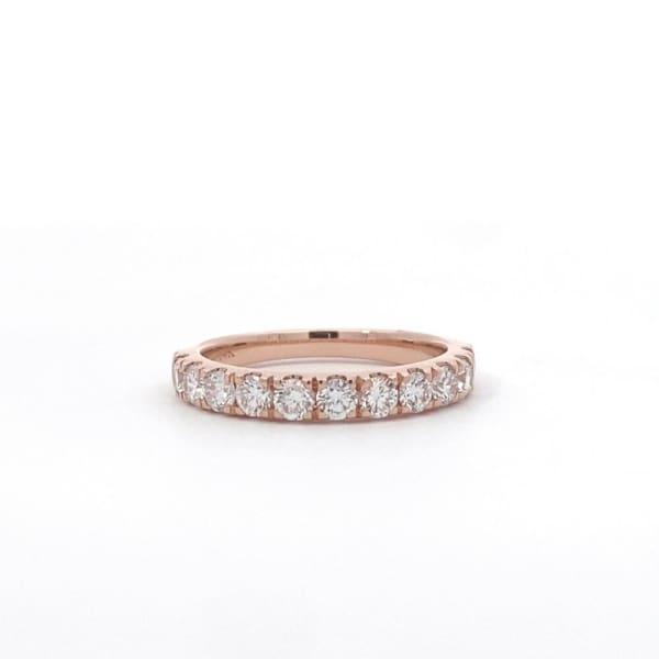 The 1.10ct Round Brilliant Cut Lab Diamond Wedding Ring in rose gold showcases a row of round-cut diamonds elegantly set in a minimalist band, perfectly presented against a plain white background.