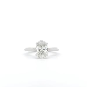 The 1.71ct Oval Lab Grown Diamond Engagement Ring is showcased on a white background, featuring a dazzling oval-cut diamond at its center.