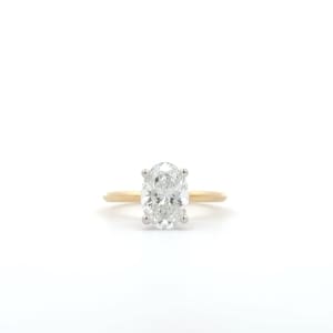 A 2.05-carat oval lab-grown diamond engagement ring featuring a hidden halo, showcased against a plain white background.