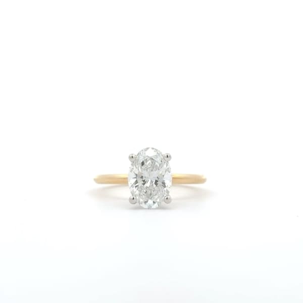 A 2.05-carat oval lab-grown diamond engagement ring featuring a hidden halo, showcased against a plain white background.