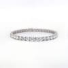 A sleek and elegant 14k white gold tennis bracelet featuring a single row of round, sparkling lab diamonds totaling 2.14 carats, showcased on a simple, light background.