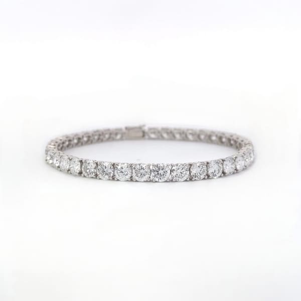 A sleek and elegant 14k white gold tennis bracelet featuring a single row of round, sparkling lab diamonds totaling 2.14 carats, showcased on a simple, light background.