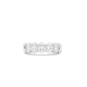 The 3.55ct Oval Lab Diamond Half Eternity Ring showcases a series of oval-shaped clear gemstones set in a single row, elegantly displayed on a plain white background.
