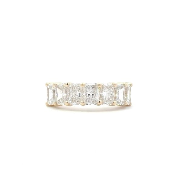 Introducing the 3.55ct Radiant Lab Diamond Half Eternity Ring, a stunning gold ring adorned with five uniformly sized rectangular, clear lab diamonds arranged in a row, creating a dazzling visual effect against a plain white background.