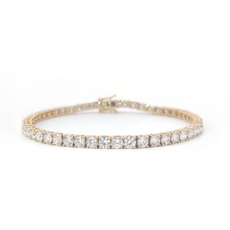 This 5.27ct lab-grown diamond tennis bracelet, set in 14k yellow gold, features a continuous line of dazzling round diamonds against a white background. Elegantly crafted, it showcases a classic and sophisticated design.