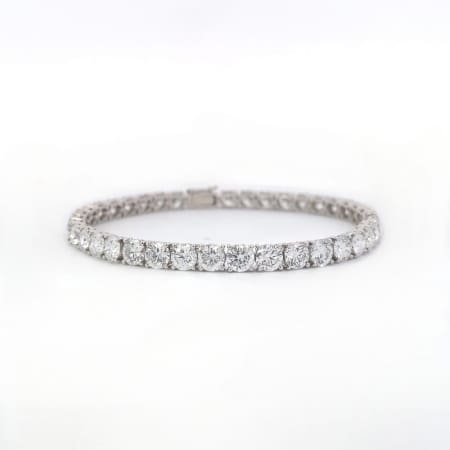 A 7.85ct Lab Grown Diamond Tennis Bracelet in 14k White Gold, featuring a row of round, sparkling diamonds displayed on a white background.