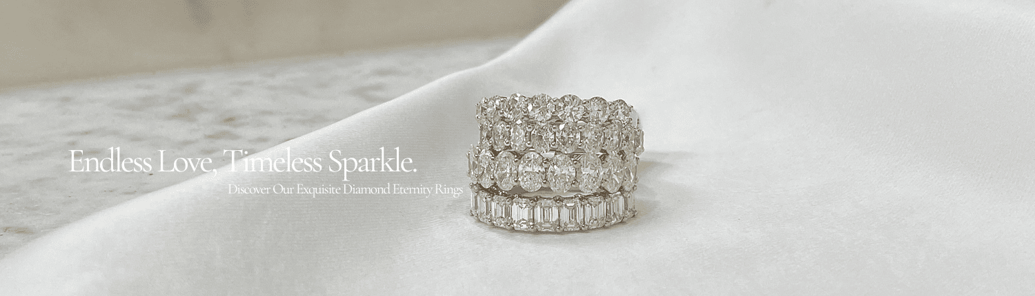 A stack of three diamond eternity rings displayed on a white satin fabric. The rings vary in design, featuring different cuts of diamonds. Text reads: "Endless Love. Timeless Sparkle. Discover Our Exquisite Diamond Eternity Rings.