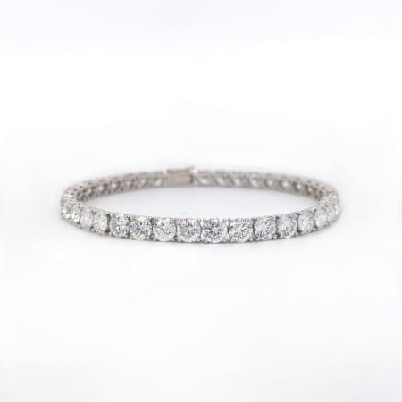 A dazzling 14K white gold tennis bracelet featuring 4.00 carats of round brilliant cut lab-created diamonds in a claw setting, elegantly presented on a white backdrop.