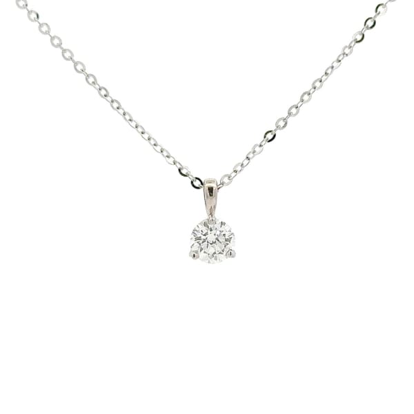 The 70pts Solitaire Lab Diamond Pendant in 14k White Gold showcases a delicate silver chain adorned with a sparkling round-cut diamond. The diamond is elegantly set in a classic prong setting, beautifully centered on the chain against a pristine white backdrop.