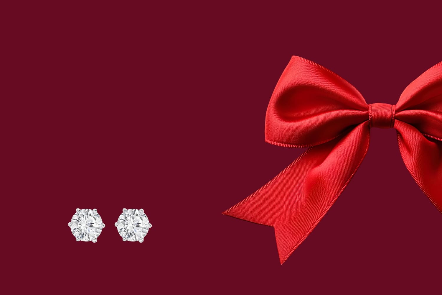 A pair of diamond stud earrings and a large red ribbon bow are displayed against a dark red background. The diamonds sparkle brightly, contrasting with the rich color of the bow.