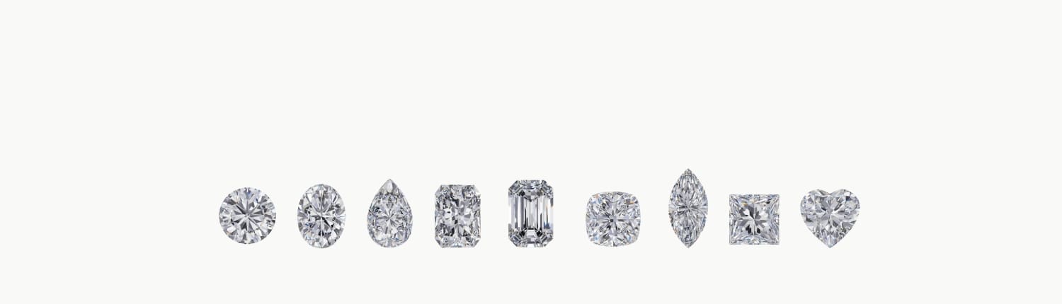 A row of nine differently shaped diamonds, including round, pear, oval, emerald, asscher, marquise, radiant, princess, and heart shapes, displayed against a plain white background.