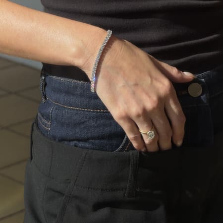Lab-grown diamond tennis bracelet worn on wrist in 14k white gold